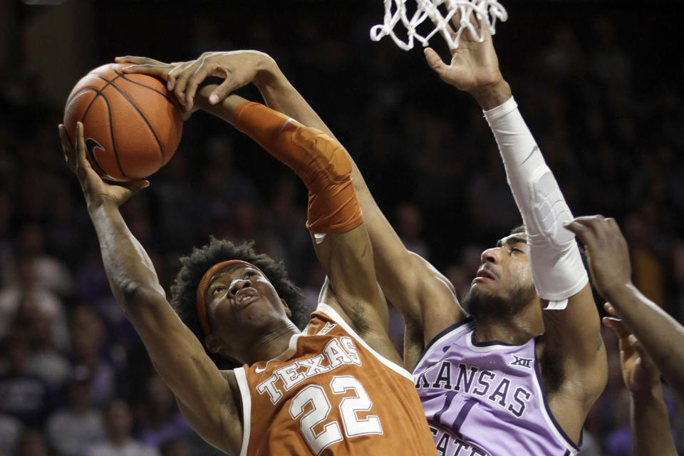 Texas forward Kai Jones (22) is fouled by Kansas State forward Antonio Gordon (11) during the first half of an NCAA college basketball game in Manhattan, Kan., Saturday, Feb. 22, 2020. (AP Photo/Orlin Wagner)