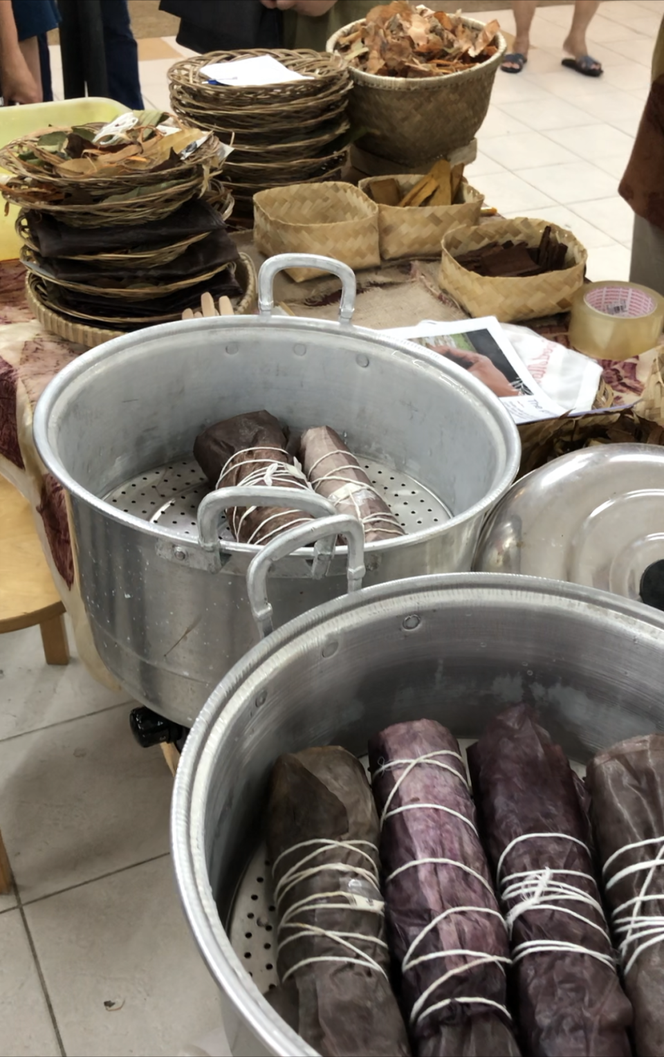 Steaming the leaves in the rolled-up fabrics to create natural dyes. (PHOTO: Sheila Chiang/Yahoo Lifestyle Singapore)