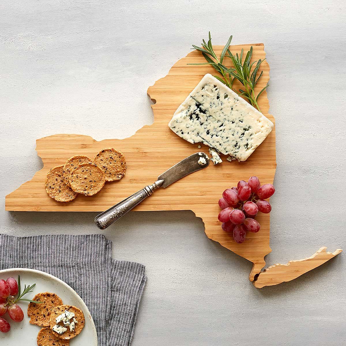 <p><a href="https://go.redirectingat.com?id=74968X1596630&url=https%3A%2F%2Fwww.uncommongoods.com%2Fproduct%2Fstate-cheese-boards&sref=https%3A%2F%2Fwww.thepioneerwoman.com%2Fhome-lifestyle%2Fentertaining%2Fg32293314%2Fhostess-gifts-ideas%2F" rel="nofollow noopener" target="_blank" data-ylk="slk:Shop Now;elm:context_link;itc:0;sec:content-canvas" class="link rapid-noclick-resp">Shop Now</a></p><p>State-Shaped Cheese Boards</p><p>uncommongoods.com</p>