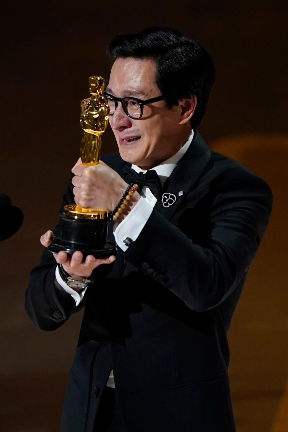 Ke Huy Quan accepts the award for best actor in a supporting role for his performance in "Everything Everywhere All at Once."