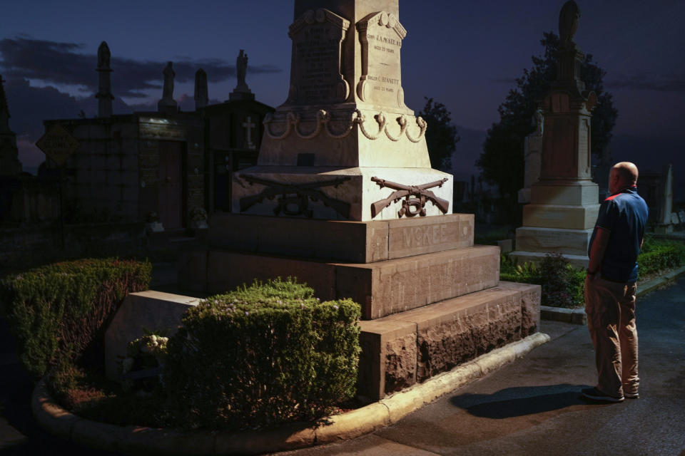 A man pauses by the cenotaph following an Anzac Day dawn service at Waverley Cemetery in Sydney, Australia, Tuesday, April 25, 2023. (AP Photo/Mark Baker)