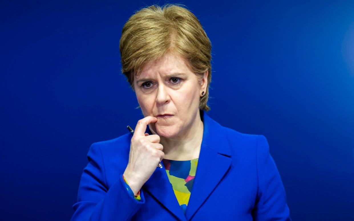 Nicola Sturgeon scratches her mouth - Jane Barlow/PA Wire