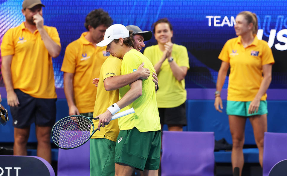 Alex de Minaur, pictured here with Lleyton Hewitt after beating Novak Djokovic at the United Cup. 