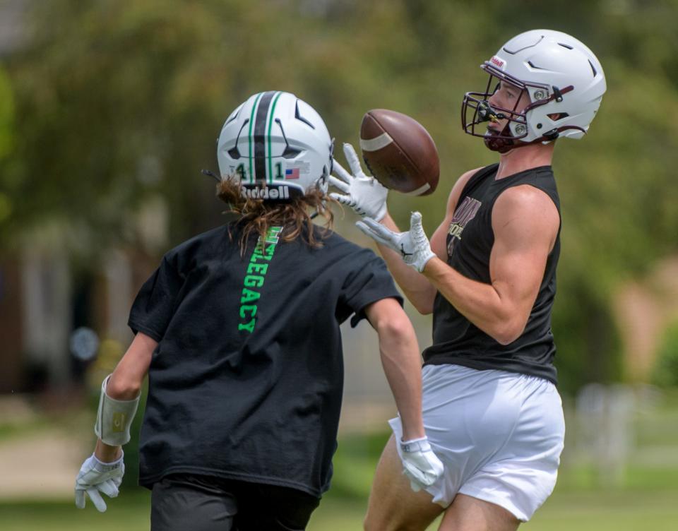 Eureka and Dunlap players battle during the annual 7-on-7 football camp Saturday, July 20, 2024 hosted by Washington Community High School.