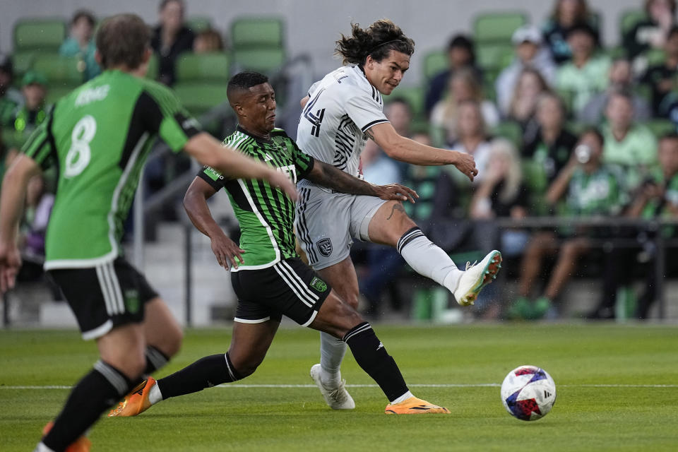 San Jose Earthquakes midfielder Jackson Yueill, right, takes a shot past Austin FC midfielder Jhojan Valencia, center, during the first half of an MLS soccer match in Austin, Texas, Saturday, April 29, 2023. (AP Photo/Eric Gay)