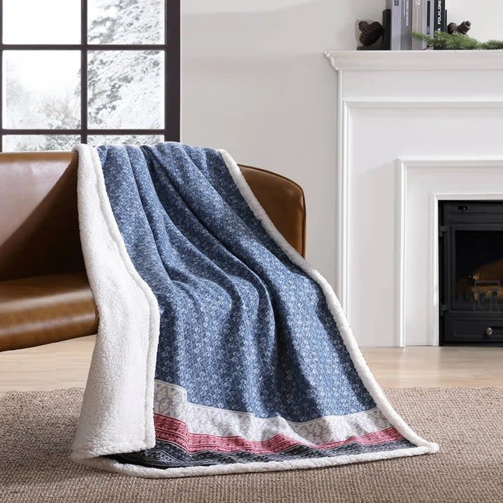 the throw in fair isle blue on a couch