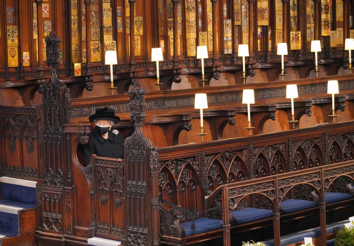 Queen Elizabeth II takes her seat for the funeral of the Duke of Edinburgh in St George's Chapel, Windsor Castle, Berkshire. Picture date: Saturday April 17, 2021.