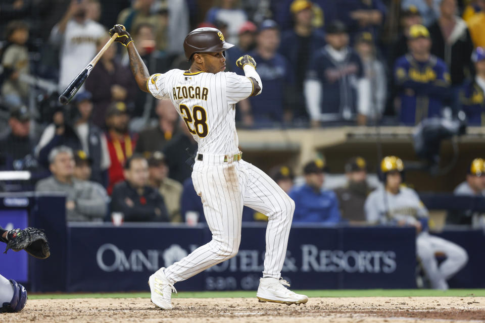 San Diego Padres' Jose Azocar hits a walkoff single to defeat the Milwaukee Brewers 3-2 during the tenth inning of the baseball game Monday, May 23, 2022, in San Diego. (AP Photo/Mike McGinnis)