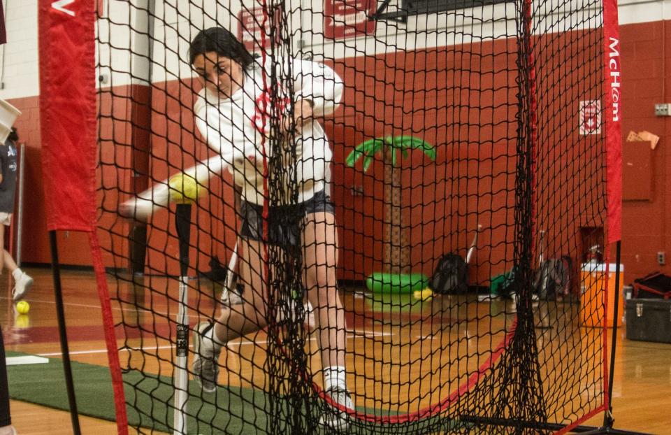 North Rockland senior shortstop Ally Murphy hits softballs into the net during practice at North Rockland High School on June 7, 2023.