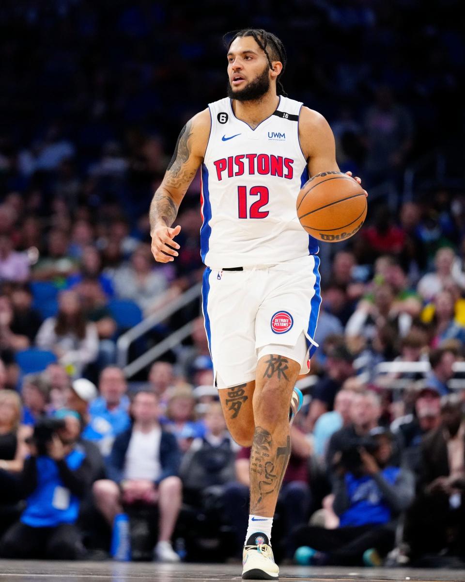 Pistons forward Isaiah Livers dribbles the ball down the court against the Magic during the second quarter of the Pistons' 128-102 loss on Sunday, April 2, 2023, in Orlando, Florida.