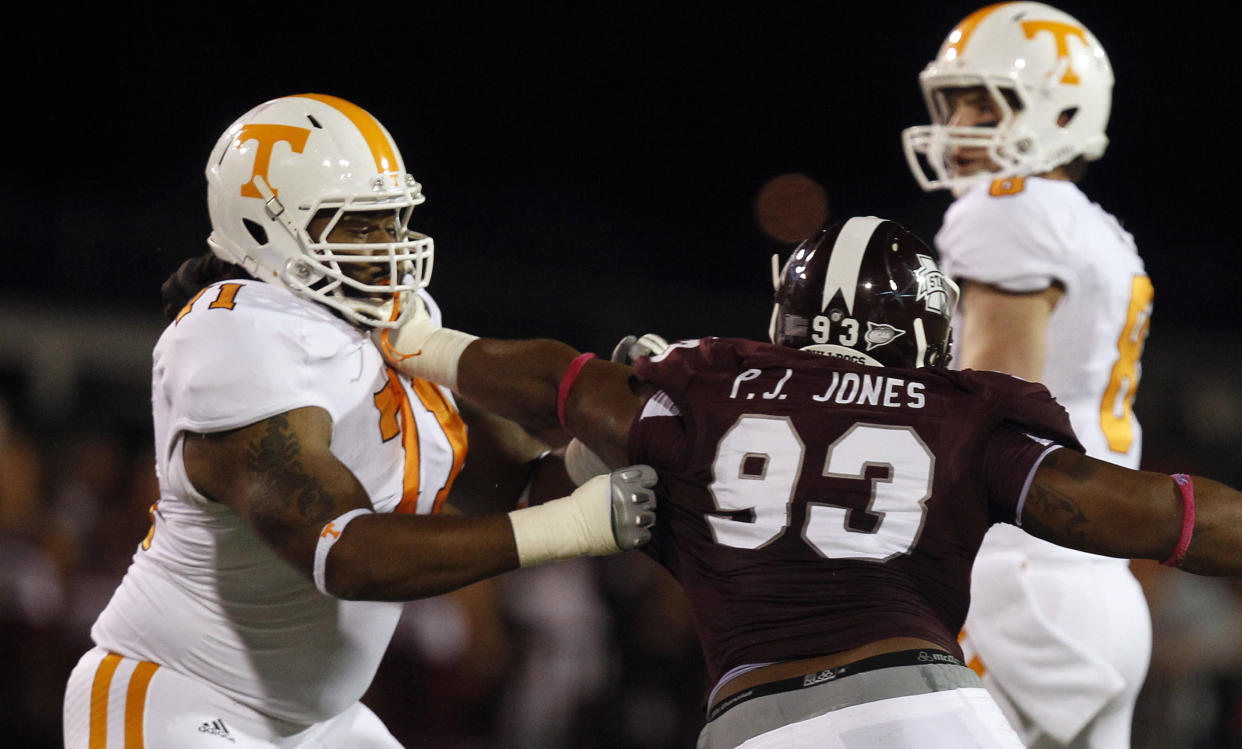 STARKVILLE, MS - OCTOBER 13: Offensive linesman Dallas Thomas #71 of the Tennessee Volunteers blocks defensive lineman P.J. Jones #93 of the Mississippi State Bulldogs as quarterback Tyler Bray #8 of the Tennessee Volunteers drops back to pass against Mississippi State Bulldogs on October 13, 2012 at Davis Wade Stadium in Starkville, Mississippi. (Photo by Butch Dill/Getty Images)