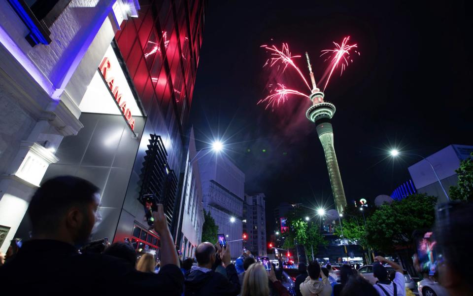 Fireworks burst from the Sky Tower in Auckland, New Zealand, to celebrate the New Year
