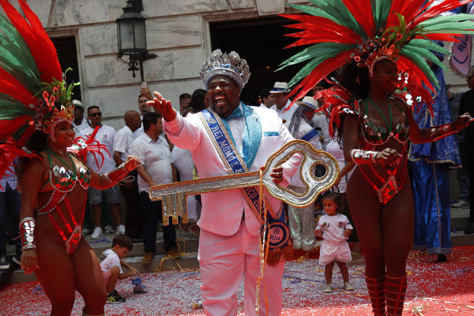 Carnival King Momo, Djferson Mendes da Silva, holds the key to the city during the official start of Carnival in Rio de Janeiro, Brazil, Friday, Feb. 17, 2023. (AP Photo/Bruna Prado)