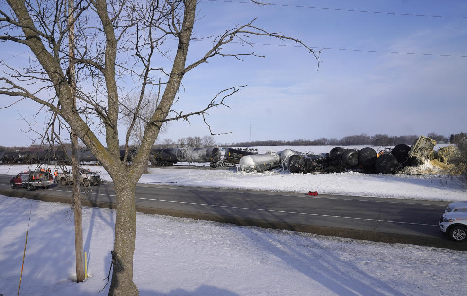 Emergency personnel respond to the scene after a BNSF train derailed in Raymond, Minn., Thursday, March 30, 2023. The train hauling ethanol and corn syrup derailed and caught fire early Thursday and nearby residents were ordered to evacuate their homes, authorities said.(David Joles /Star Tribune via AP)