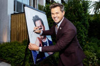 <p>Andrew Rannells signs his portrait at Los Angeles Confidential celebrates "Portraits of Pride" on June 9 in L.A.</p>