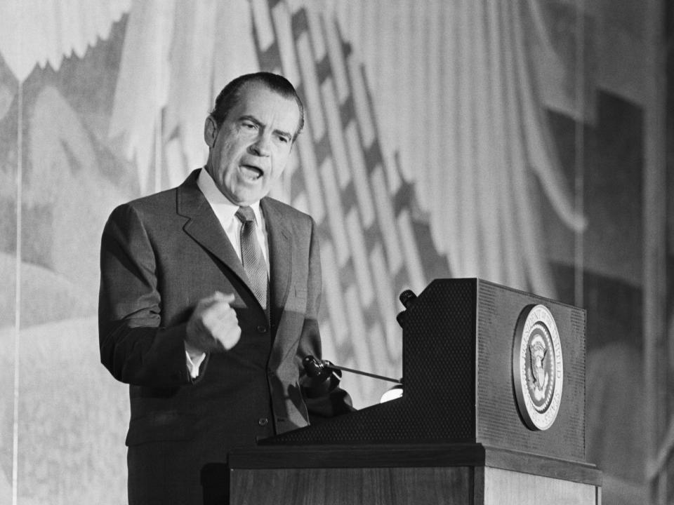 President Richard Nixon speaking at a podium in 1969.