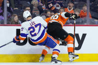 New York Islanders' Anders Lee, left, and Philadelphia Flyers' Joel Farabee collide during the second period of an NHL hockey game, Monday, Feb. 6, 2023, in Philadelphia. (AP Photo/Matt Slocum)