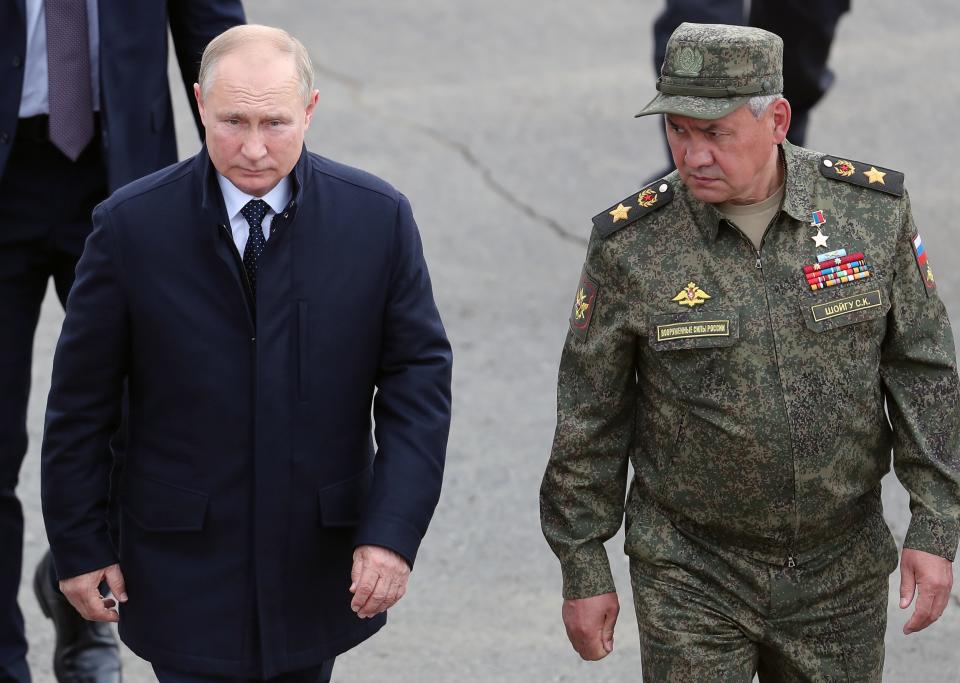 Russian President Vladimir Putin, left, and Russian Defense Minister Sergei Shoigu arrive to attend the joint strategic exercise of the armed forces of the Russian Federation and the Republic of Belarus Zapad-2021 at the Mulino training ground in the Nizhny Novgorod region, Russia, Monday, Sept. 13, 2021. The military drills attend by servicemen of military units and divisions of the Western Military District, representatives of the leadership headquarters and personnel of military contingents of the armed forces of Armenia, Belarus, India, Kazakhstan, Kyrgyzstan and Mongolia. (Sergei Savostyanov, Sputnik, Kremlin Pool Photo via AP)
