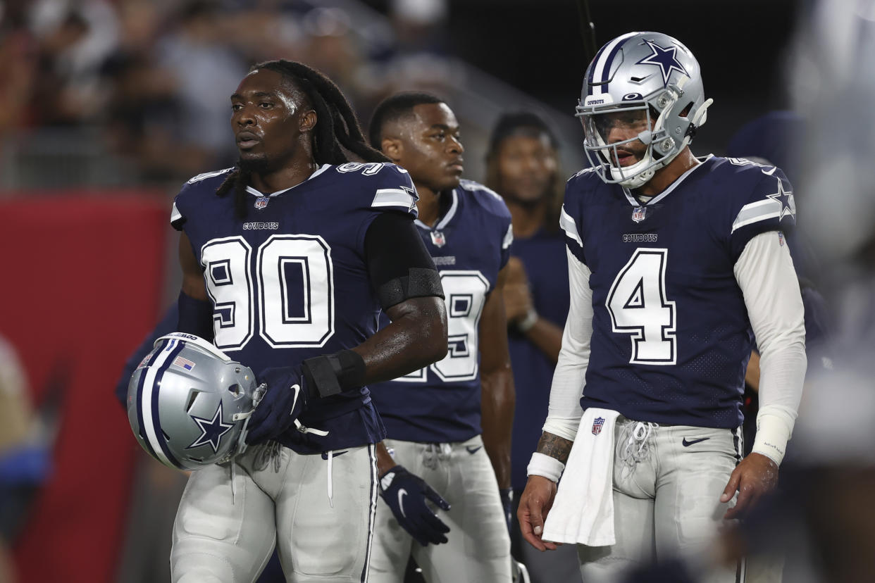 Cowboys defensive end DeMarcus Lawrence (90) is out for a reported 6-8 weeks with a broken foot, which he suffered at practice this week. (AP Photo/Mark LoMoglio)