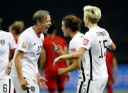 Jun 30, 2015; Montreal, Quebec, CAN; United States defender Kelley O'Hara (5) celebrates with forward Abby Wambach (20) after scoring against Germany during the second half of the semifinals of the FIFA 2015 Women's World Cup at Olympic Stadium. Mandatory Credit: Michael Chow-USA TODAY Sports