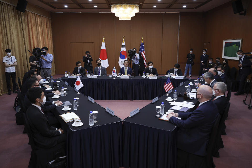 Kim Gunn, center, South Korea's new special representative for Korean Peninsula peace and security affairs, his U.S. counterpart Sung Kim, center at right, and Japanese counterpart Takehiro Funakoshi, center at left, attend their meeting at the Foreign Ministry in Seoul, South Korea Friday, June 3, 2022. (Kim Hong-Ji/Pool Photo via AP)