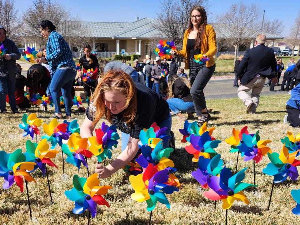 Each of the pinwheels planted on The Bridge lawn Friday represents a child the organization served last year, which was an increase from the previous year. The Pinwheels of Prevention is among several events throughout April to raise awareness for Child Abuse Prevention Month.
