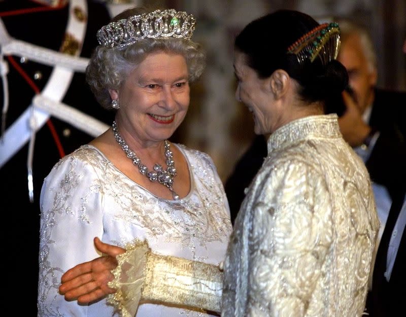 FILE PHOTO: Britain's Queen Elizabeth II (L) smiles to dancer Carla Fracci as she introduces a guest at Quirinal..