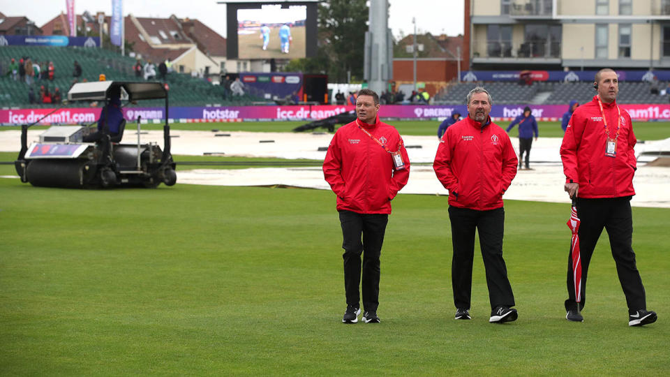 Umpires inspect the field during the bad weather. (Photo by Nick Potts/PA Images via Getty Images)