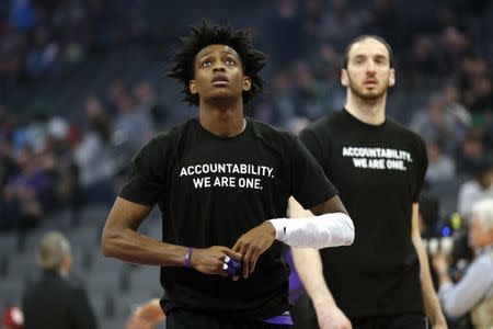 Mar 25, 2018; Sacramento, CA, USA; Sacramento Kings guard De'Aaron Fox (5) stands on the court before the start of the game against the Boston Celtics at Golden 1 Center. Players from both teams wore t-shirts during warmups in honor of Stephon Clark, a Sacramento native who was recently shot and killed by Sacramento police. Cary Edmondson-USA TODAY Sports