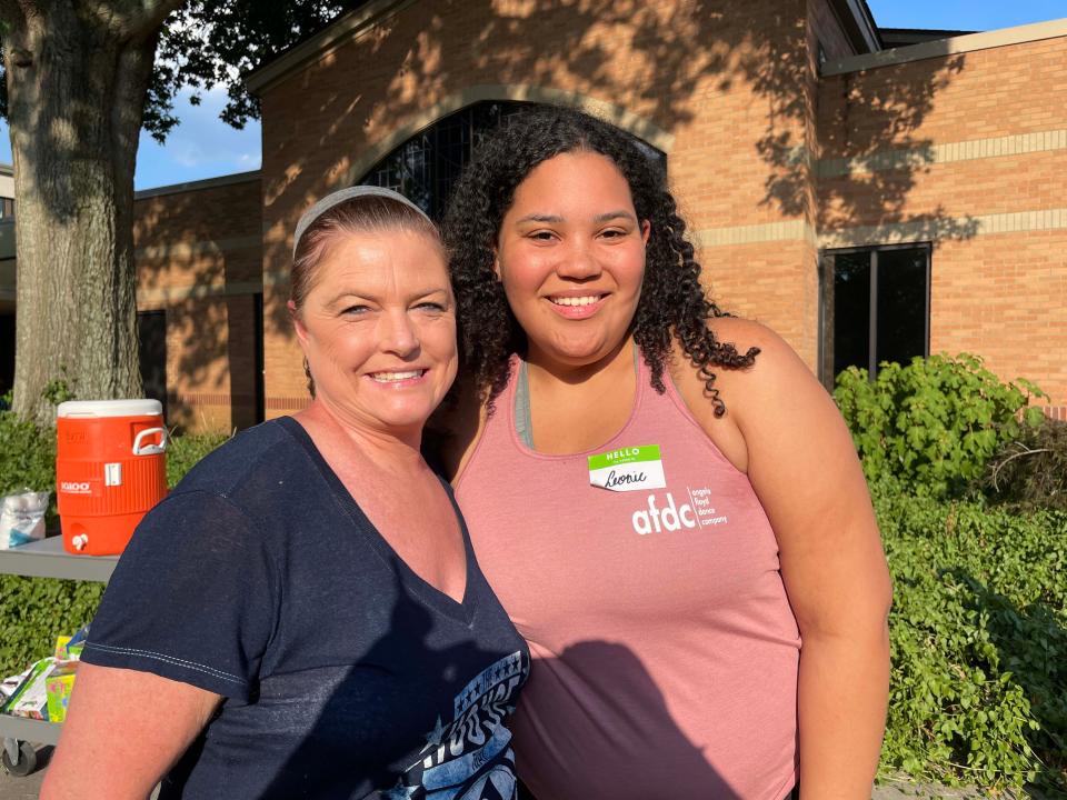 Youth Leader Jennifer Julius and Leonie Manthey share a clean hug before the slime comes into play at a slime battle at Concord United Methodist Church on Wednesday, June 23, 2022.