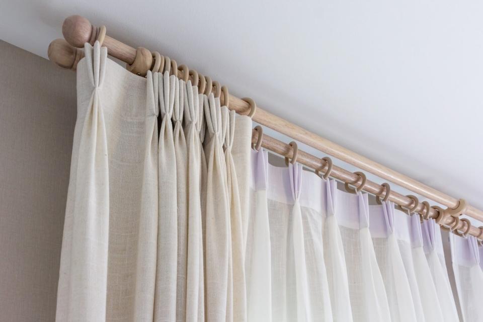 Cream curtain on curtain rod