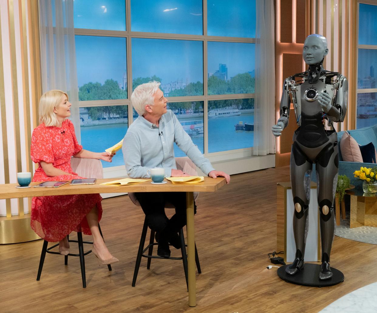 Phillip Schofield, Holly Willoughby, and Ameca The Robot on This Morning (ITV/Shutterstock)