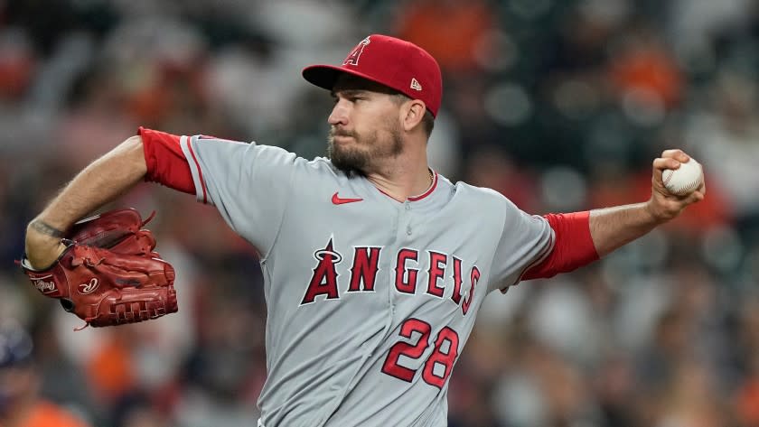 Los Angeles Angels starting pitcher Andrew Heaney throws against the Houston Astros during the first inning of a baseball game Friday, April 23, 2021, in Houston. (AP Photo/David J. Phillip)