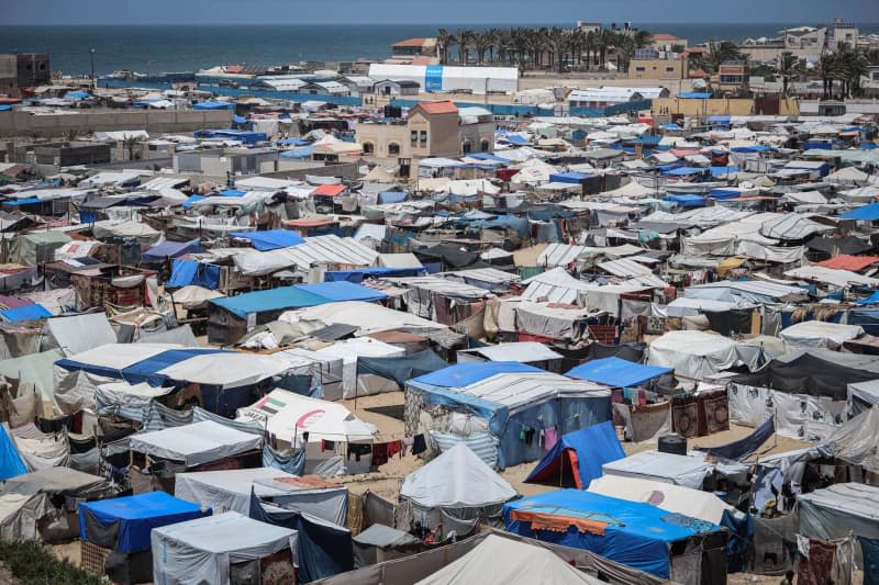 Tents for displaced people are crowded west of Deir al-Balah city in the central Gaza Strip after thousands of Palestinians fled Rafah after the Israeli army announced the start of a military operation there. Saher Alghorra/ZUMA Press Wire/dpa