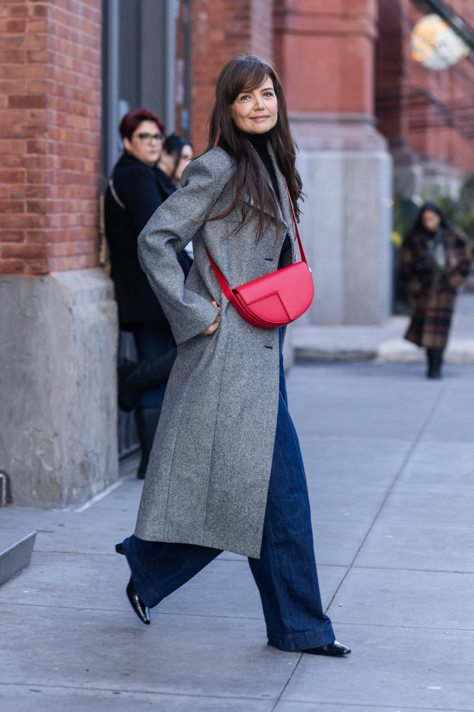 Katie Holmes Adds a Pop of Festive Red to a Neutral Winter Outfit