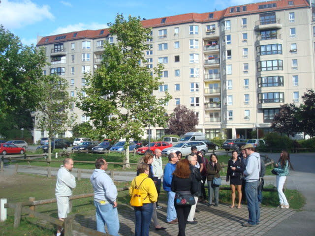 A tour guide explaining to a group of visitors on the site in Berlin where Nazi Germany's dictator Adolf Hitler died. His body was burnt at the then New Reich Chancellery, somewhere around the car park in this residential area. PHOTO: Vernon Lee/Yahoo News Singapore 