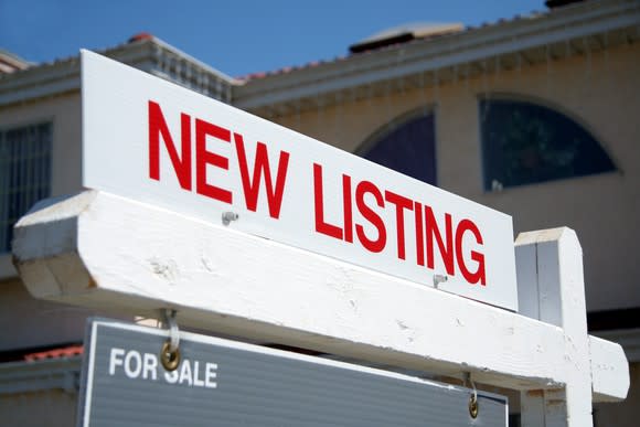 A new listing for-sale sign in front of a house