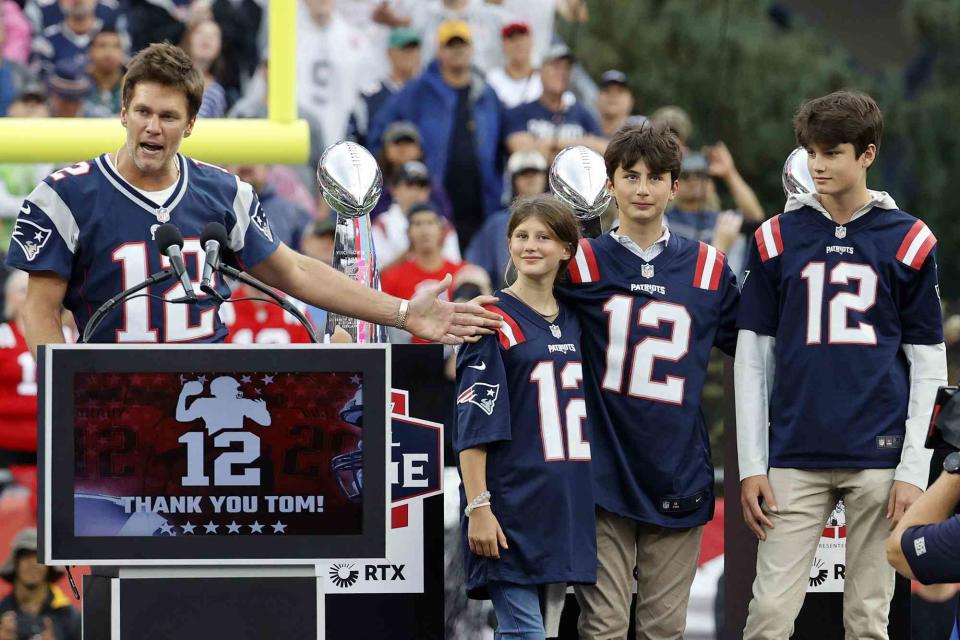 <p>Fred Kfoury III/Icon Sportswire via Getty</p> (L-R) Tom Brady with kids Vivian, Benjamin and Jack