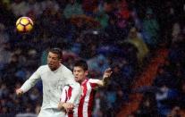 Football Socer - Real Madrid v Sporting Gijon - Spanish La Liga Santander - Santiago Bernabeu Stadium, Madrid, Spain - 26/11/16. Real Madrid's Cristiano Ronaldo and Sporting Gijon's Jorge Mere in action. REUTERS/Susana Vera