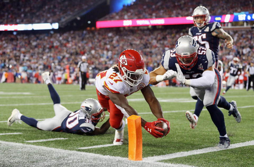 <p>Kareem Hunt #27 of the Kansas City Chiefs dives for the pylon to score a 4-yard rushing touchdown during the fourth quarter against the New England Patriots at Gillette Stadium on September 7, 2017 in Foxboro, Massachusetts. (Photo by Maddie Meyer/Getty Images) </p>