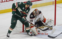 Anaheim Ducks goalie John Gibson, right, stops a scoring attempt by Minnesota Wild's Zach Parise in the first period of an NHL hockey game, Thursday, Jan. 17, 2019, in St. Paul, Minn. (AP Photo/Jim Mone)