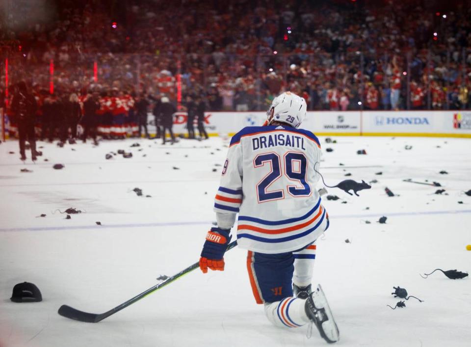 Edmonton Oilers center Leon Draisaitl (29) kneels on the ice among plastic rats as the Florida Panthers celebrate winning Game 7 of the NHL Stanley Cup Final