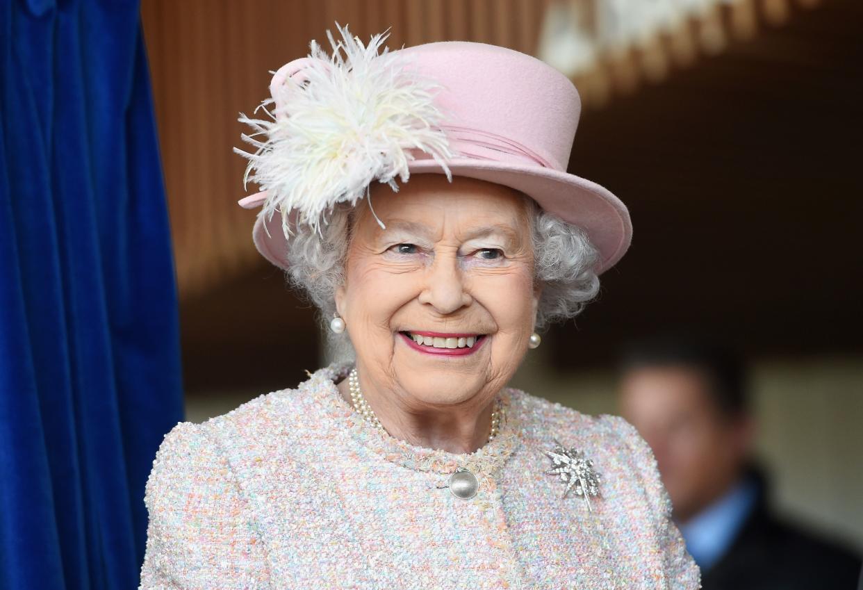Queen Elizabeth II looks breath-taking in her pink color co-operate dress with pink hat to match