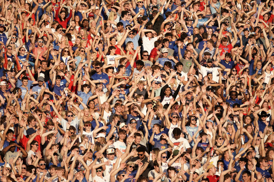 Kansas fans celebrate after a touchdown during the first half of an NCAA college football game against Missouri State Friday, Sept. 1, 2023, in Lawrence, Kan. (AP Photo/Charlie Riedel)
