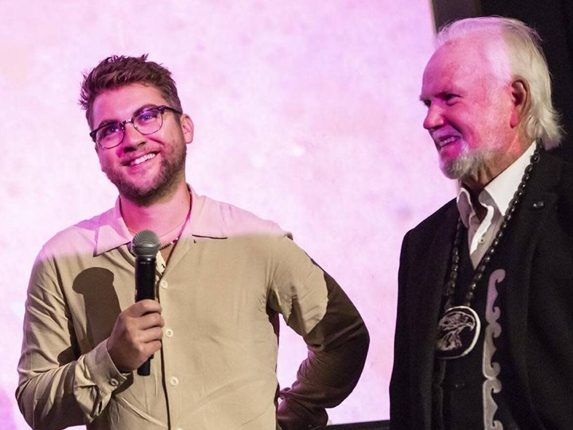 Director Jon Mann, left, and Elder Roger Augustine at the FIN Atlantic International Film Festival in Halifax for the premiere of You can call me Roger. The film follows Augustine and his climb to leadership positions over a 46-year period. (Submitted by Jon Mann - image credit)