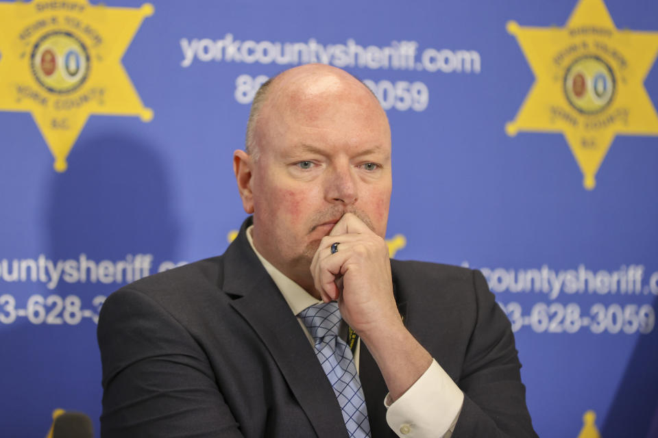 York County Sheriff Kevin Tolson listens as a 911 call is played during a press conference on Thursday, April 8, 2021, in York, S.C. where he addressed the mass shooting by former NFL football player Phillip Adams. (AP Photo/Nell Redmond)