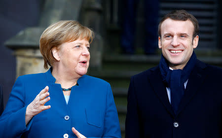 German Chancellor Angela Merkel and French President Emmanuel Macron attend a signing of a new agreement on bilateral cooperation and integration, known as Treaty of Aachen, in Aachen, Germany, January 22, 2019. REUTERS/Thilo Schmuelgen