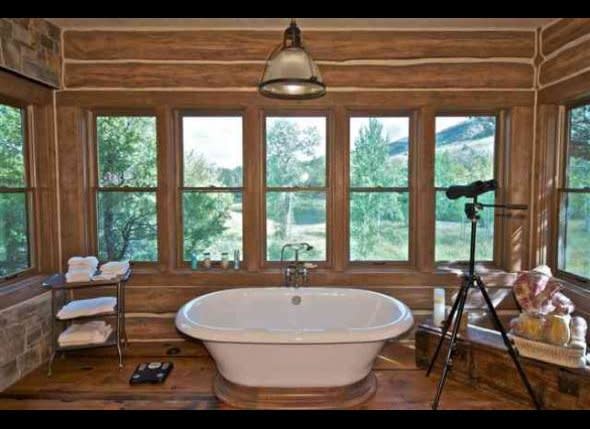 And who doesn't love a freestanding tub with views of lush greenery outdoors? To see more images of the home, head over to <a href="http://realestate.aol.com/blog/2011/10/24/house-of-the-day-dennis-quaid-lists-montana-spread/" target="_hplink">AOL Real Estate</a>.