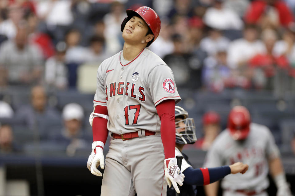 Los Angeles Angels' Shohei Ohtani reacts after being called out on strikes during the eighth inning of the first baseball game of a doubleheader against the New York Yankees on Thursday, June 2, 2022, in New York. (AP Photo/Adam Hunger)