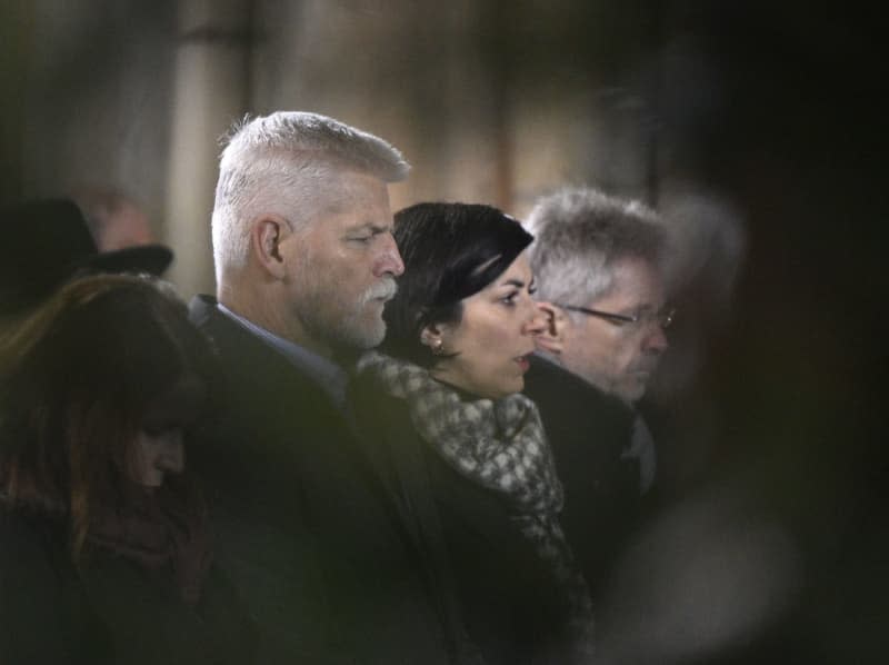 Czech President Petr Pavel (L) and Senate Speaker Milos Vystrcil (R) attend a mass commemorating the victims of a shooting at one of Charles University's buildings, as people observe a national mourning day, at St. Vitus Cathedral. Krumphanzl Michal/CTK/dpa